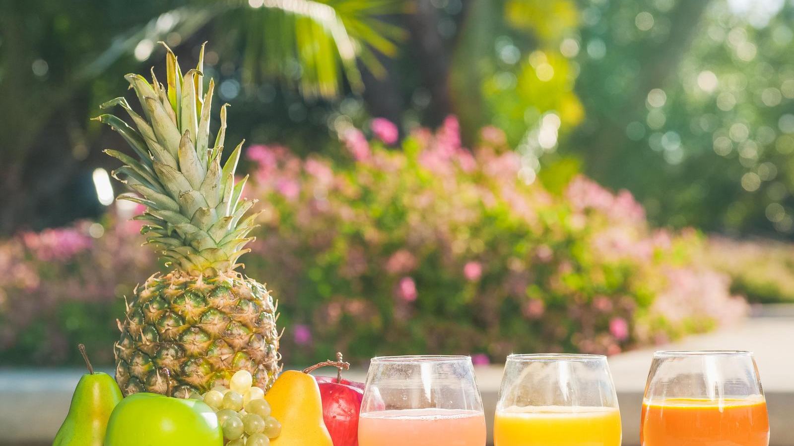 Fresh fruit juices with pineapple, apple, pear and grapes