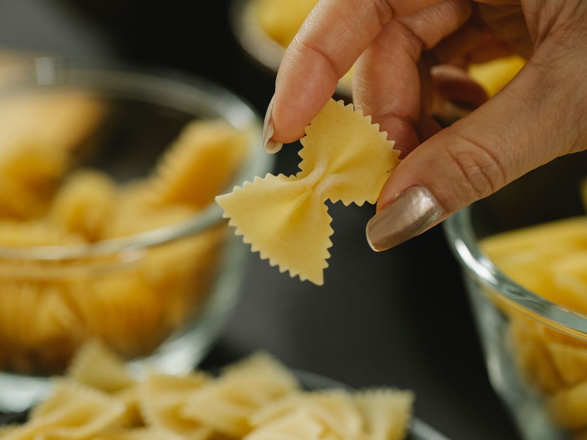 Farfalle pasta bow-ties being sorted by hand
